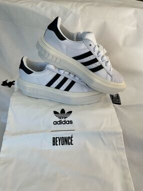 ADIDAS- BEYONCÉ SUPERSTAR PLATFORM 
White Leather Sneakers with Black Stripes